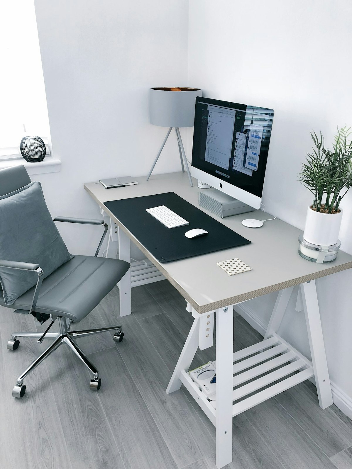 Minimalist home office setup with desk, ergonomic chair, and organized workspace